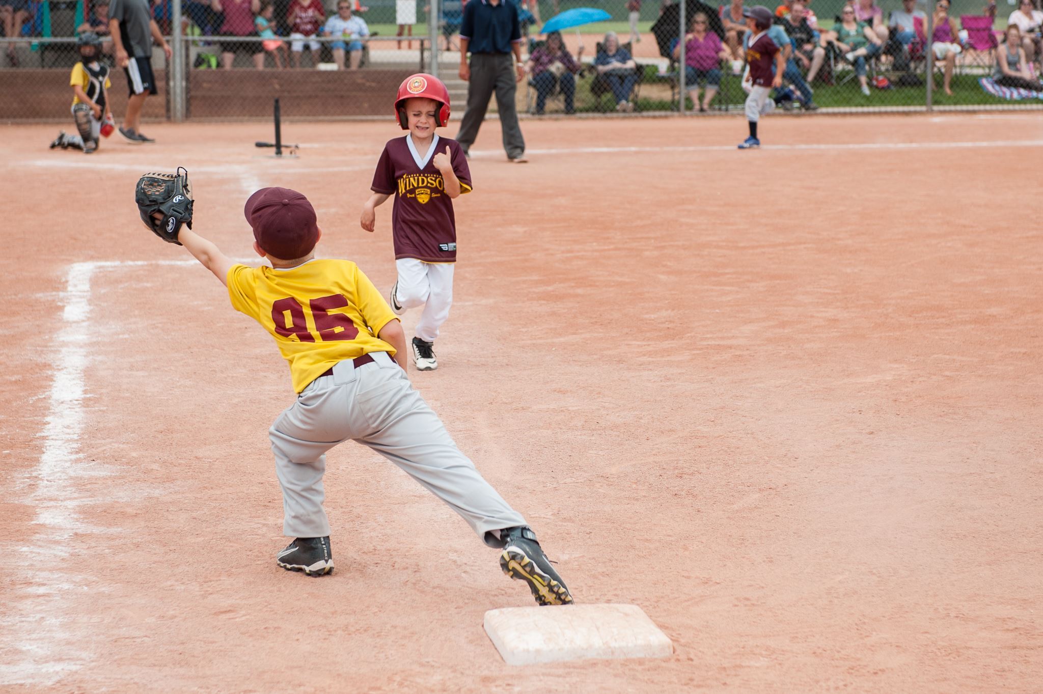 Baseman Reaches to Catch Ball