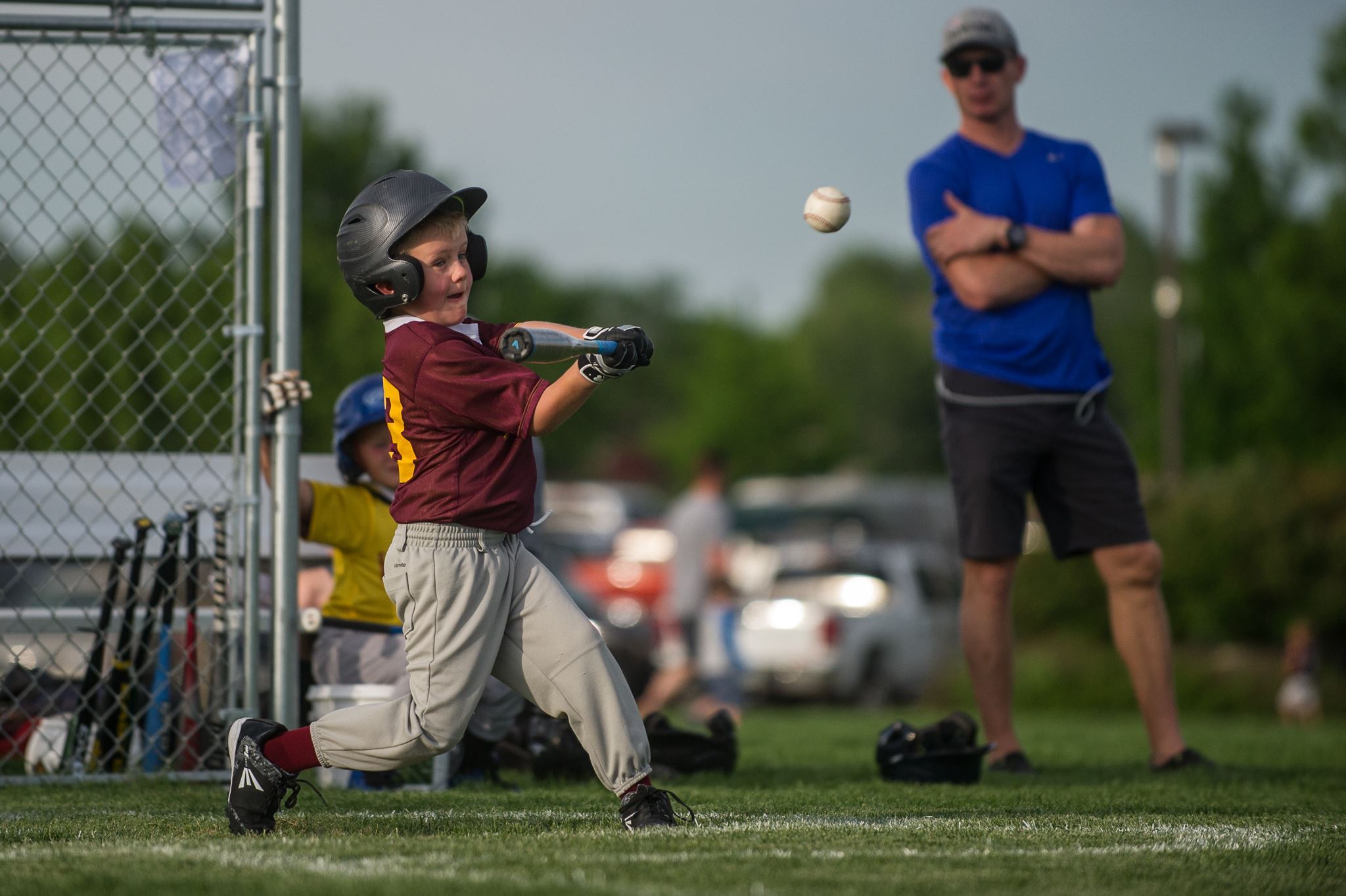 Boy Hits Ball with Bat