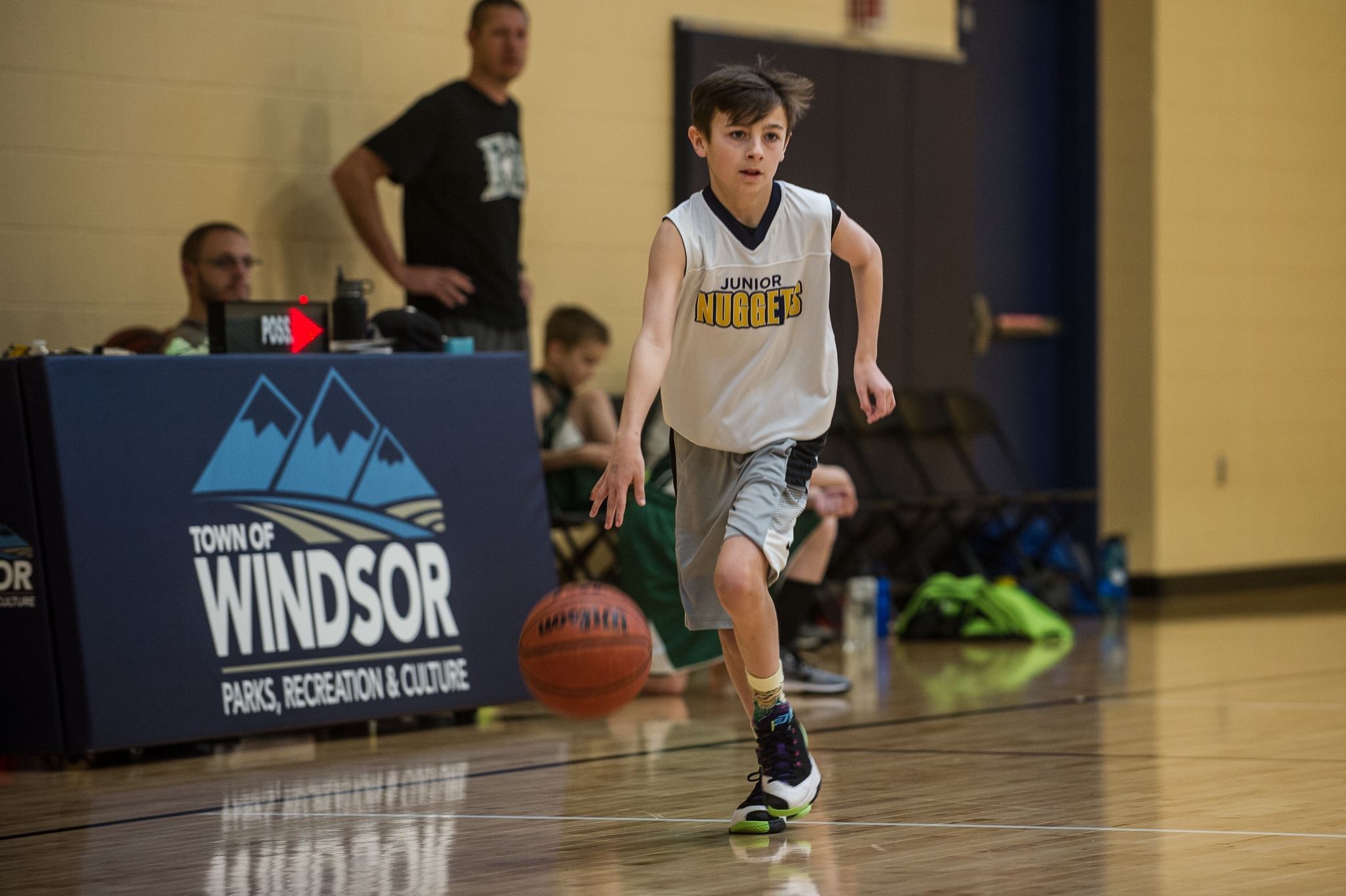 Boy Running and Dribbling Basketball