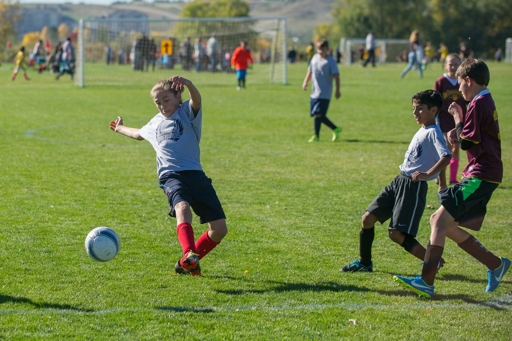 Youth Kicking Soccer Ball