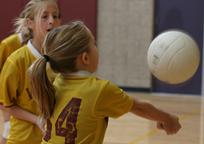 Girl Bumps Volleyball off Forearms