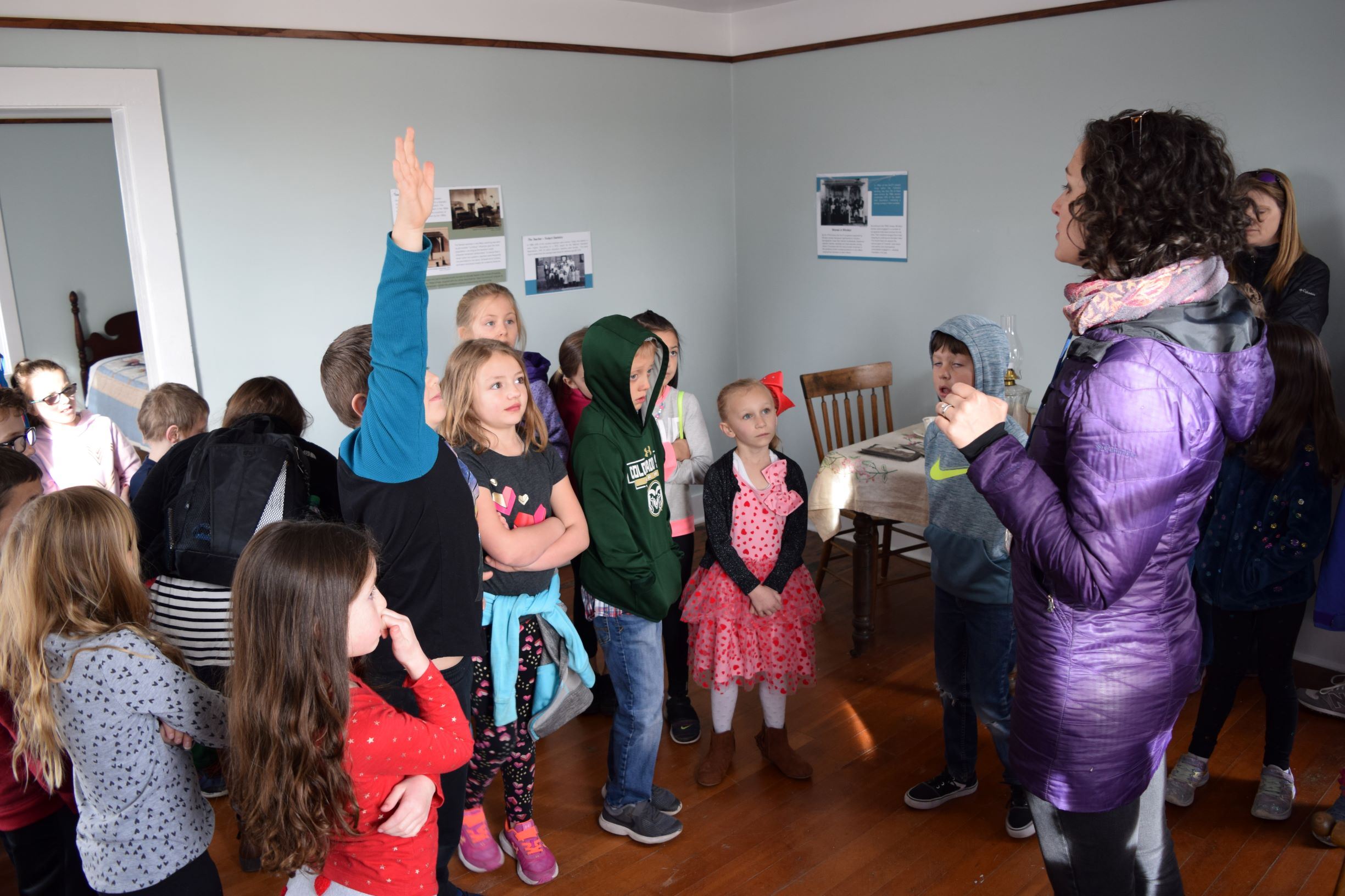 A group of students listening to a tour guide