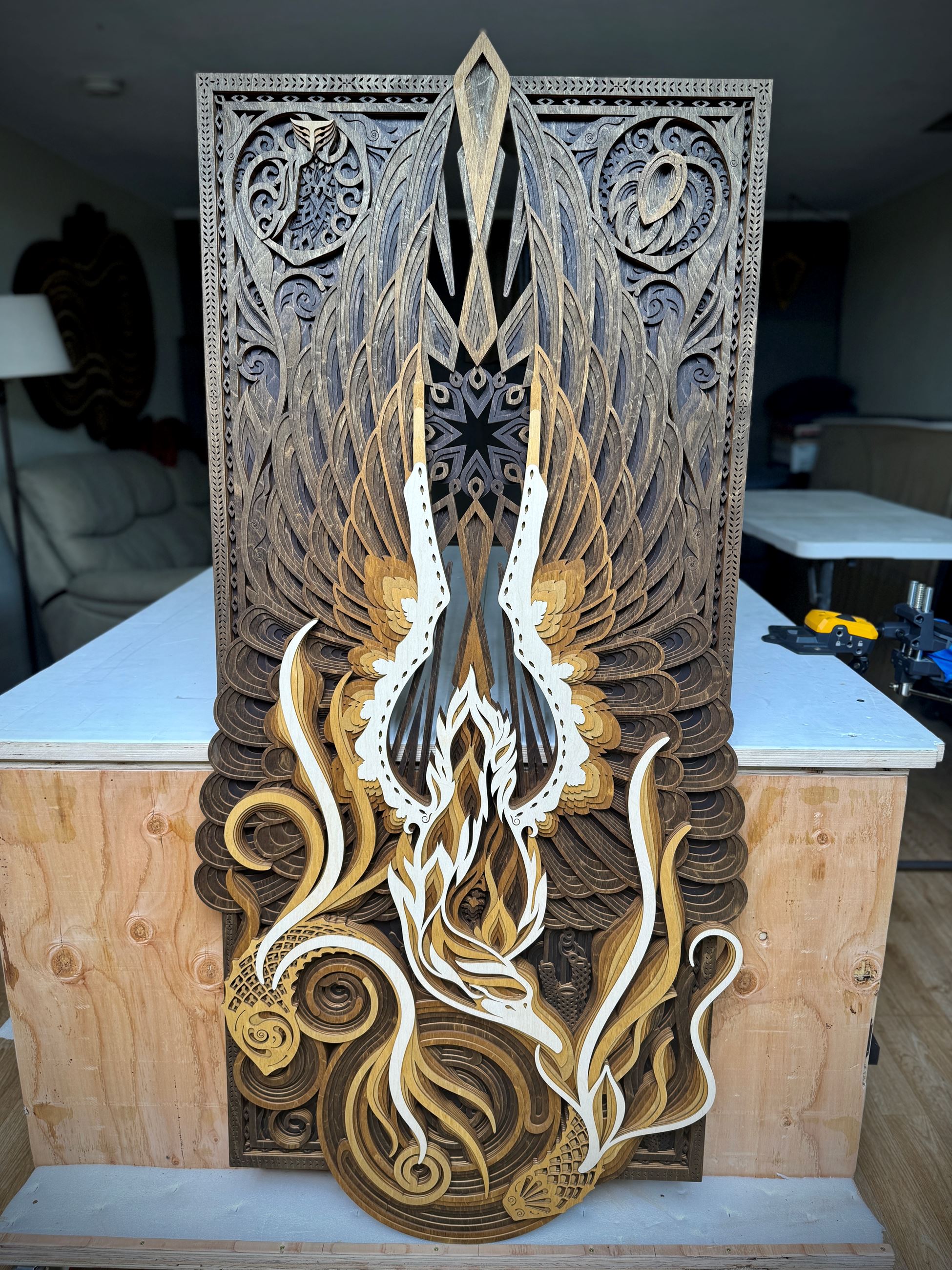 Wooden sculpture of a Swan and Koi fish.