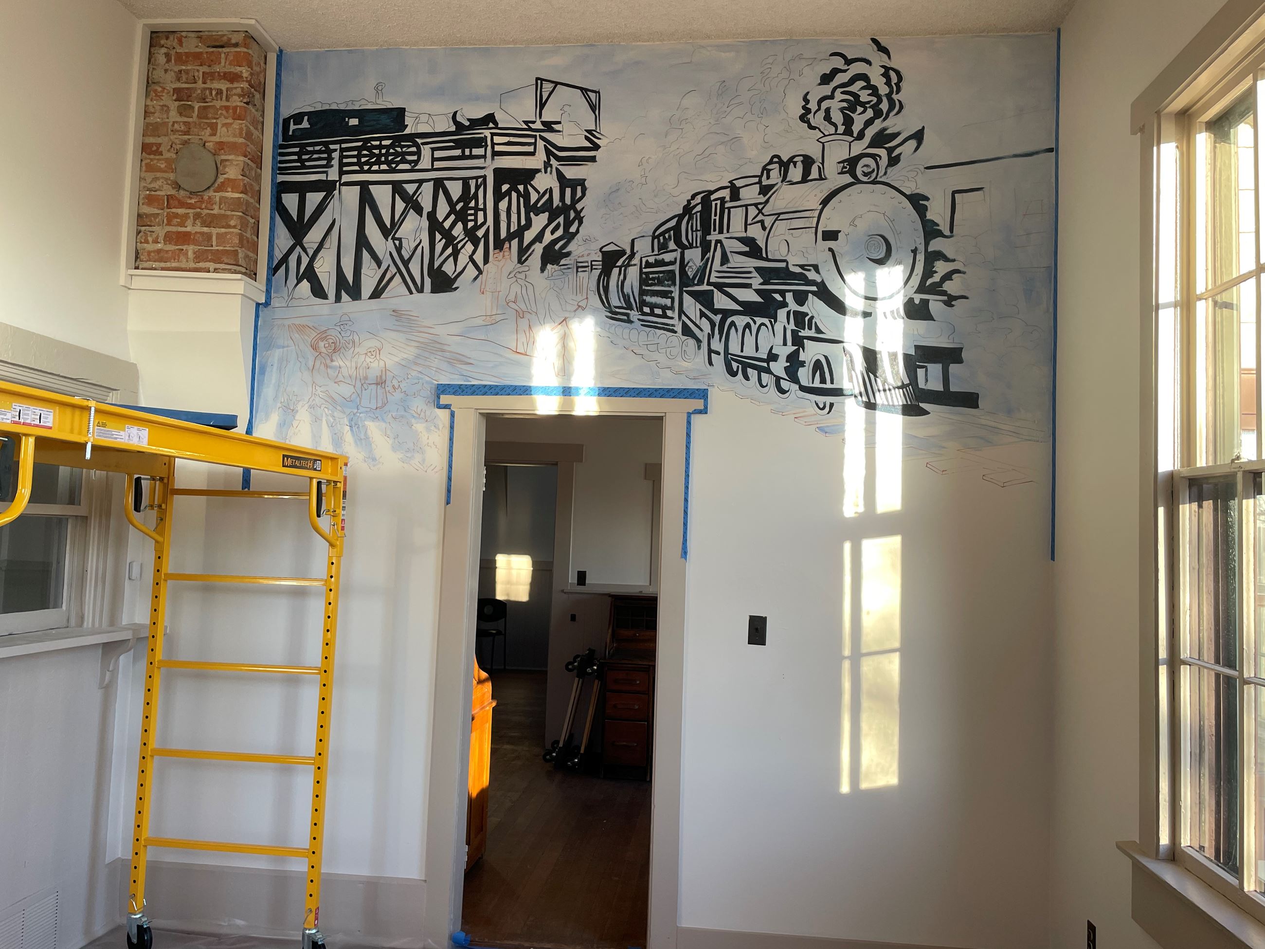 Color photograph of the beginning stages of a mural painting.