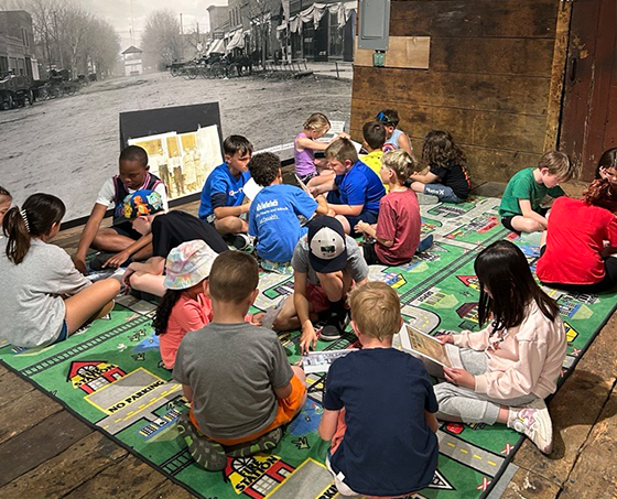 Children gathered in a group learning